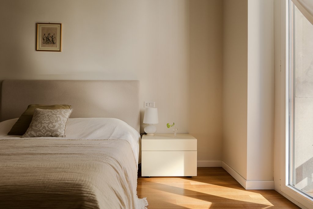 Bedroom 4 before bed reset — original messy bedding